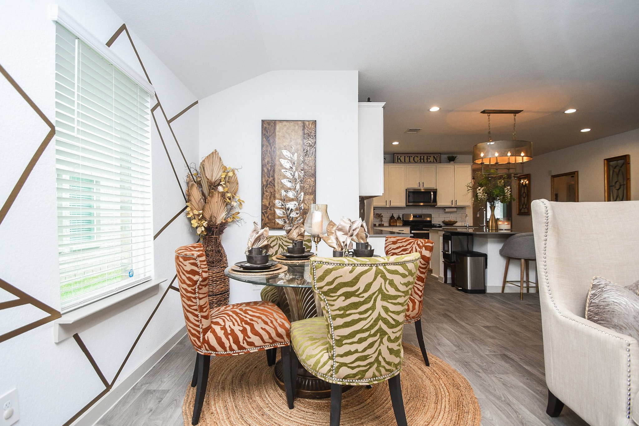7723 Golden Rubia Lane Rosharon, TX 77583 - Photo 10 of 34 a view of a dining room with furniture and wooden floor