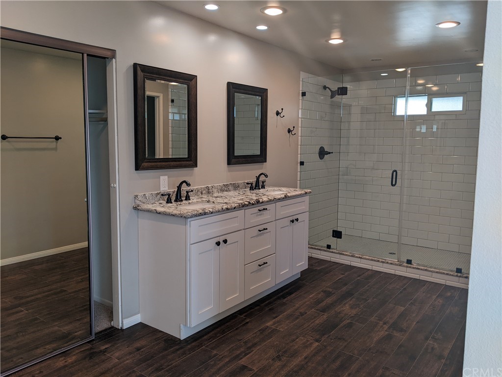633 North Buttonbush Trail Orange, CA 92869 - Photo 14 of 26 a spacious bathroom with double sink and shower