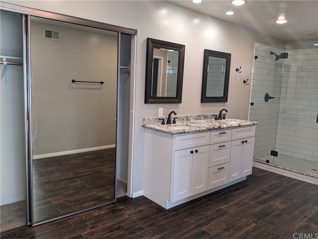 633 North Buttonbush Trail Orange, CA 92869 - Photo 15 of 26 a bathroom with a double vanity sink and mirror