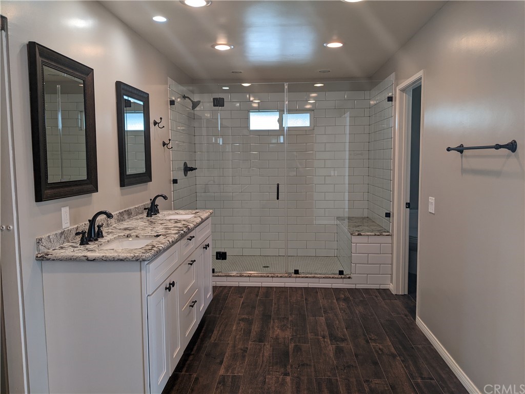 633 North Buttonbush Trail Orange, CA 92869 - Photo 16 of 26 a bathroom with a double vanity sink and mirror
