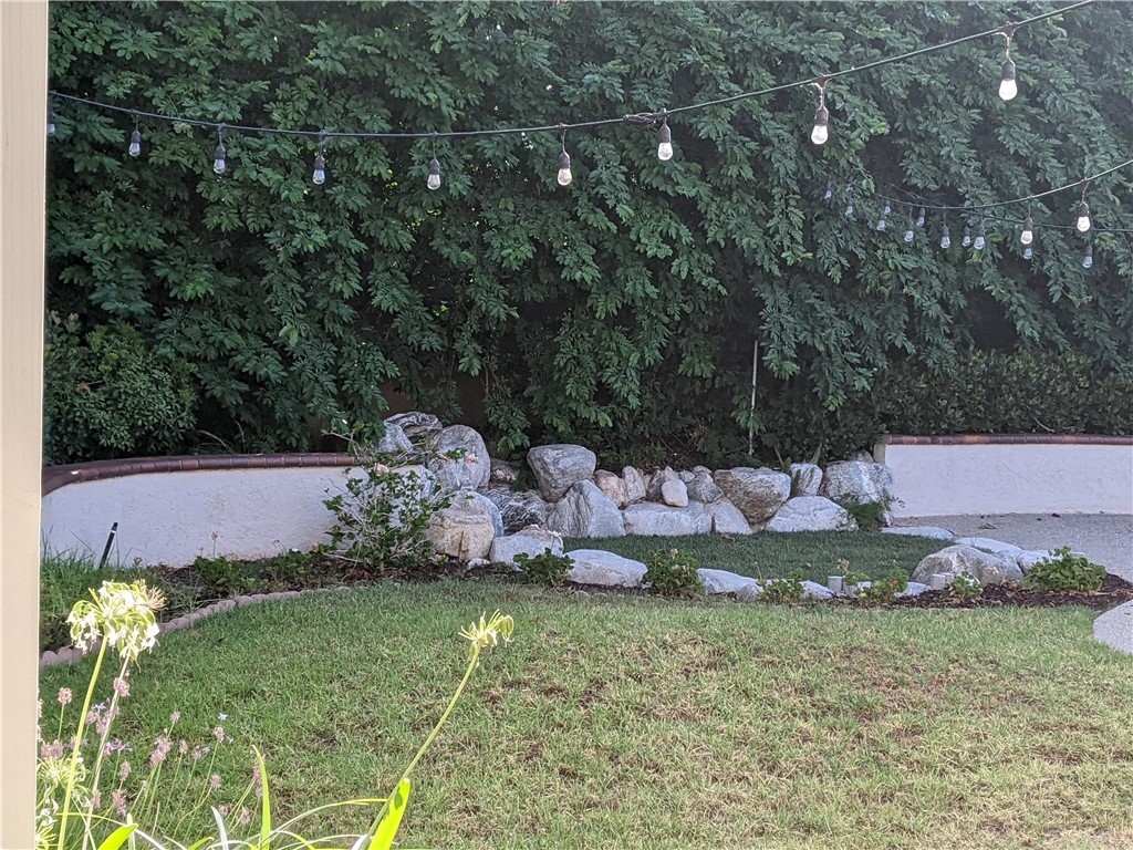 633 North Buttonbush Trail Orange, CA 92869 - Photo 22 of 26 a view of a house with a yard