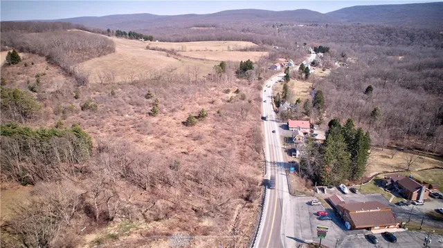 a view of a backyard with sitting area
