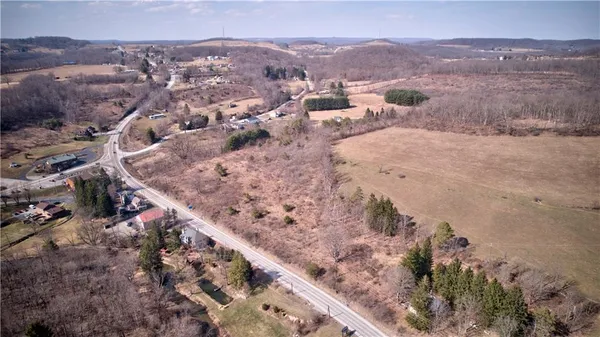 a view of a town with mountains in the background
