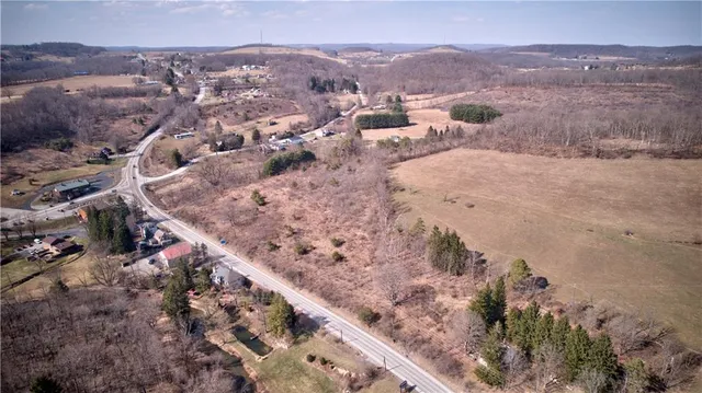 a view of a town with mountains in the background