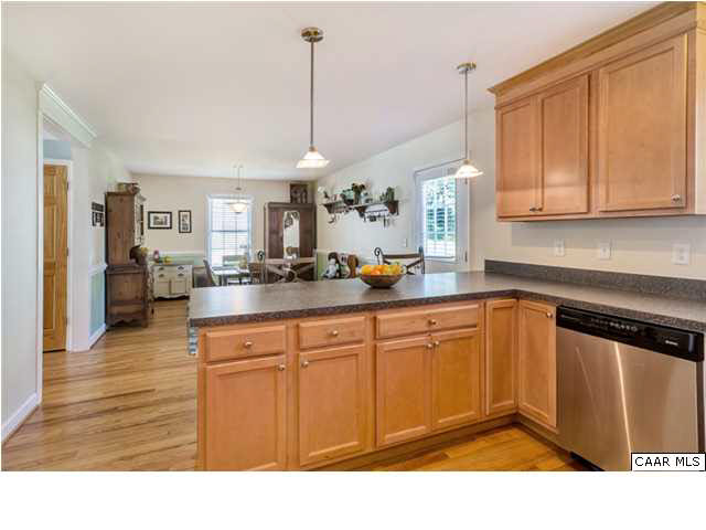 128 Roy's Place Charlottesville, VA 22902 - Photo 5 of 16 a kitchen with stainless steel appliances granite countertop a sink stove and refrigerator