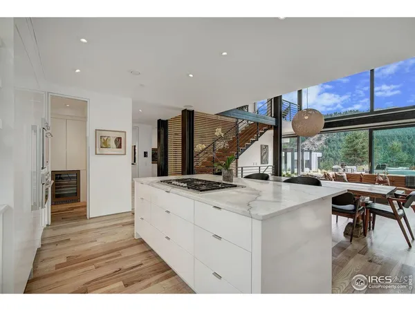 a kitchen with stainless steel appliances granite countertop a sink stove and wooden cabinets