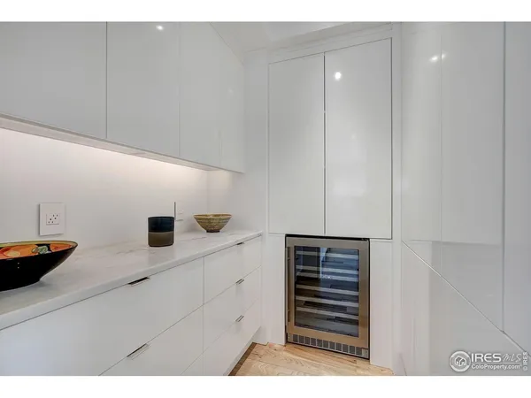 a kitchen with cabinets and window