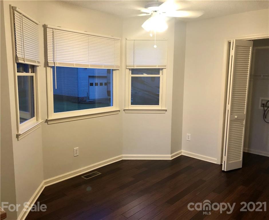 980 Coventry Road Kannapolis, NC 28081 - Photo 13 of 32 an empty room with wooden floor and window