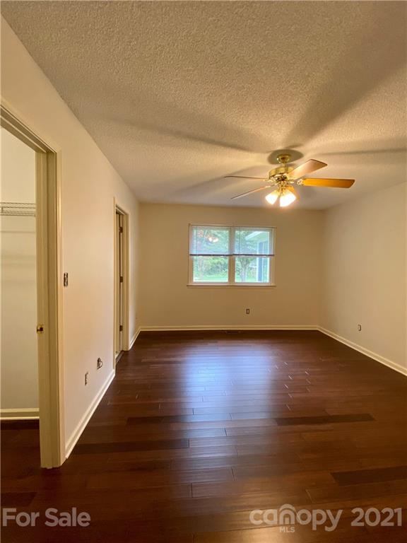 980 Coventry Road Kannapolis, NC 28081 - Photo 18 of 32 wooden floor in an empty room with a window