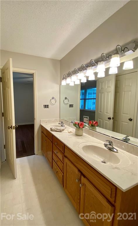 980 Coventry Road Kannapolis, NC 28081 - Photo 20 of 32 a spacious bathroom with a double vanity sink and mirror