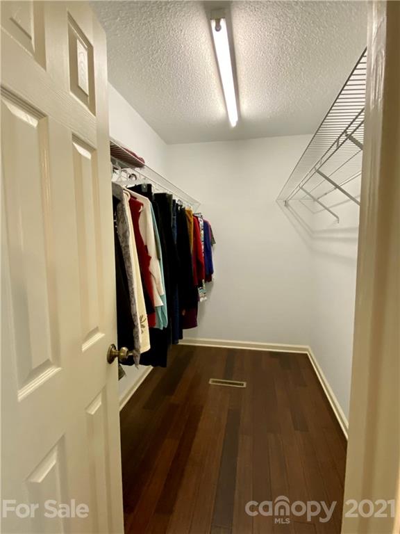 980 Coventry Road Kannapolis, NC 28081 - Photo 21 of 32 a view of walk in closet with clothes