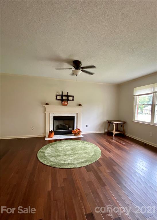 980 Coventry Road Kannapolis, NC 28081 - Photo 4 of 32 a living room with couch and a fireplace