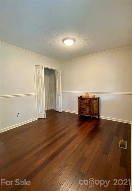 980 Coventry Road Kannapolis, NC 28081 - Photo 6 of 32 a view of empty room with wooden floor
