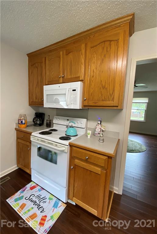 980 Coventry Road Kannapolis, NC 28081 - Photo 8 of 32 a view of a kitchen with a sink and a stove top oven
