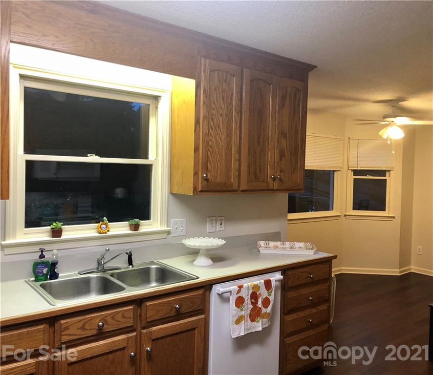 980 Coventry Road Kannapolis, NC 28081 - Photo 9 of 32 a kitchen with stainless steel appliances granite countertop a sink and a microwave