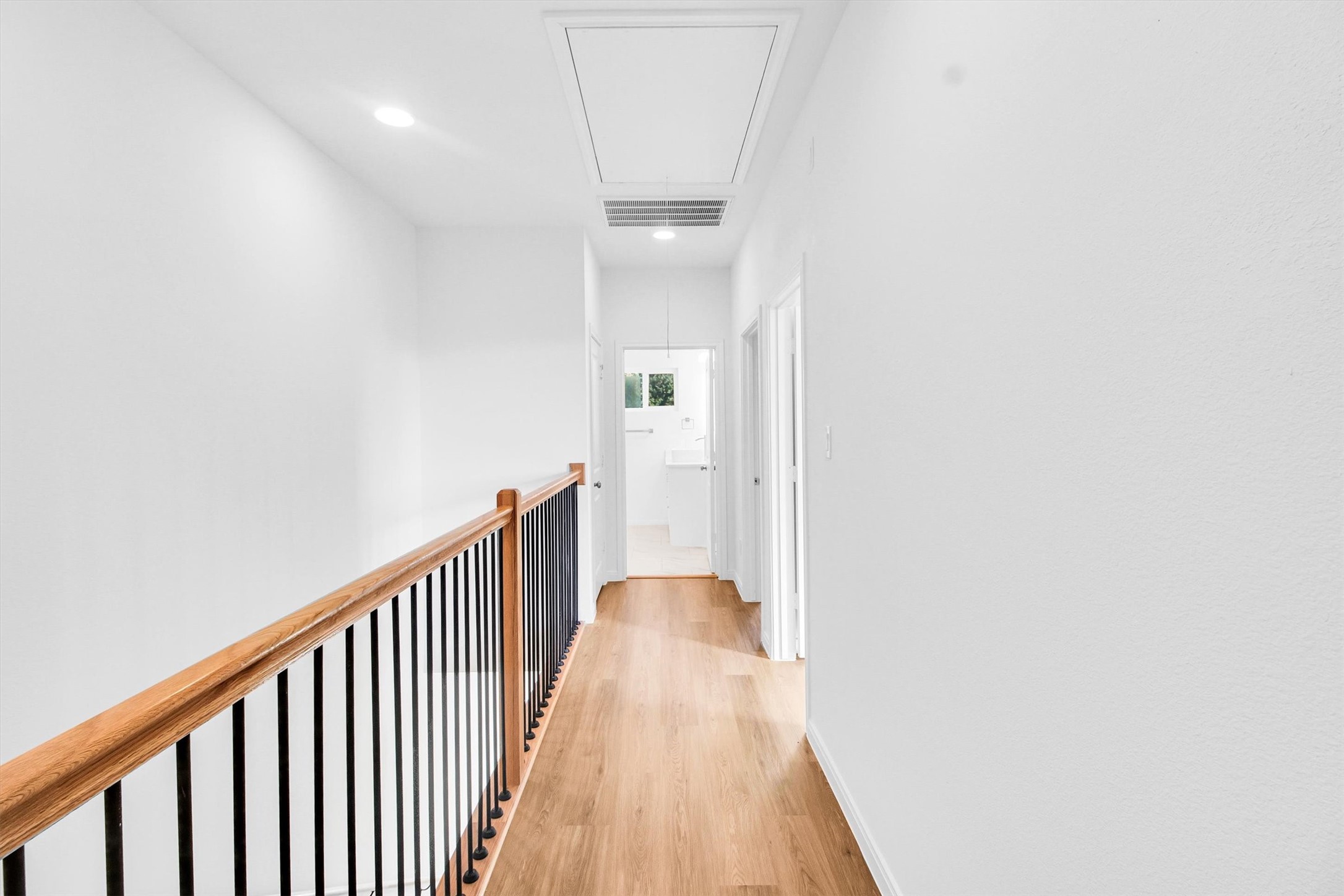 5323 Rue Street Houston, TX 77033 - Photo 15 of 34 a view of a hallway with wooden floor