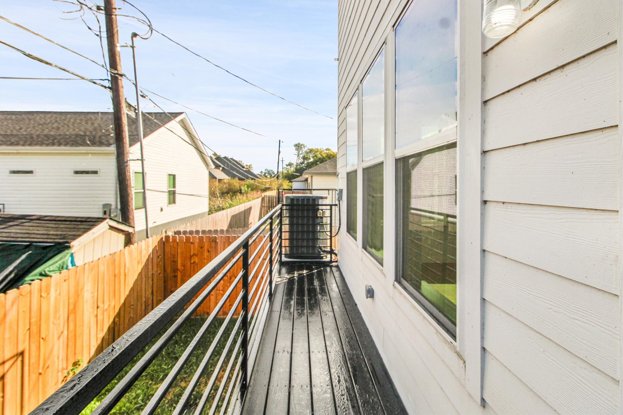 5323 Rue Street Houston, TX 77033 - Photo 31 of 34 a view of balcony with wooden floor and brick walls