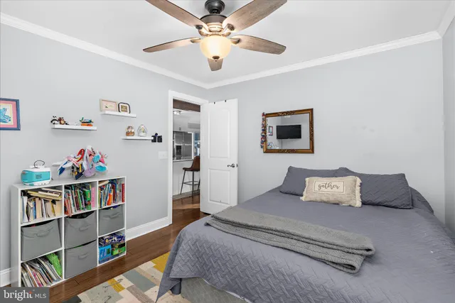 a bedroom with furniture and a book shelf
