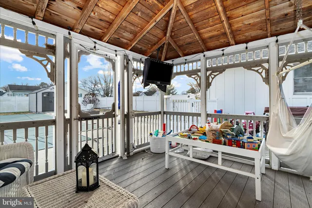 a outdoor space with lots of furniture and wooden floor