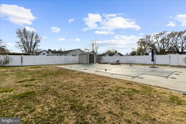 a view of swimming pool with an outdoor seating