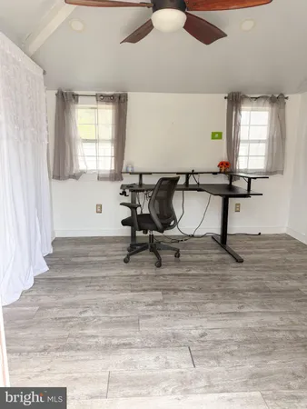 a room with gym equipment and a window