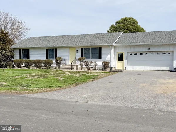 a front view of house with yard and seating area