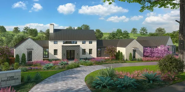 a front view of a house with a garden