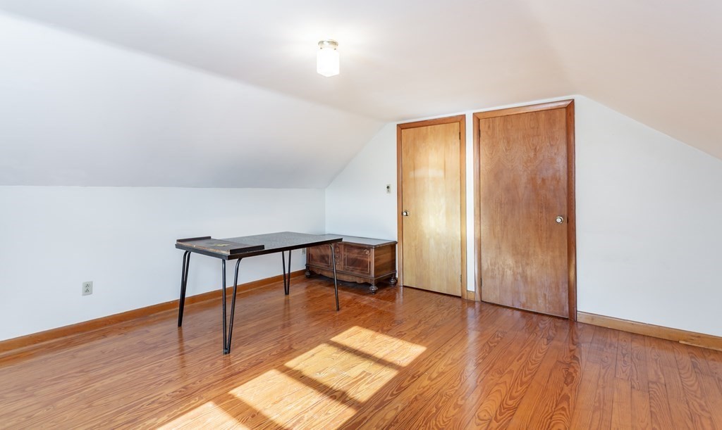 159 Hathaway Road Acushnet, MA 02743 - Photo 11 of 18 a view of an empty room with wooden floor and a window