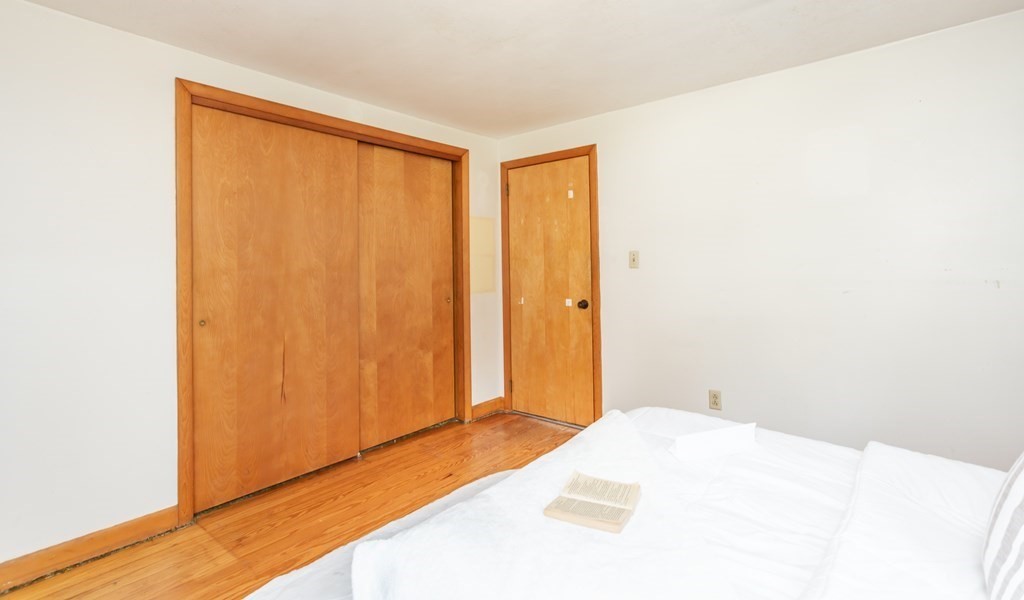 159 Hathaway Road Acushnet, MA 02743 - Photo 13 of 18 a bedroom with a bed and a window