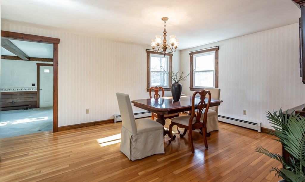 159 Hathaway Road Acushnet, MA 02743 - Photo 5 of 18 a view of a dining room with furniture and wooden floor