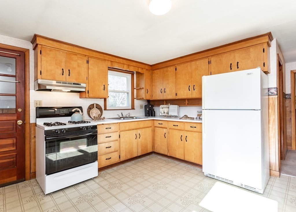 159 Hathaway Road Acushnet, MA 02743 - Photo 9 of 18 a kitchen with granite countertop cabinets stainless steel appliances and a window