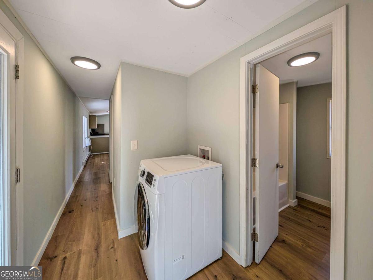 139 Anglin Road Jefferson, GA 30549 - Photo 20 of 26 a view of a hallway with wooden floor and staircase