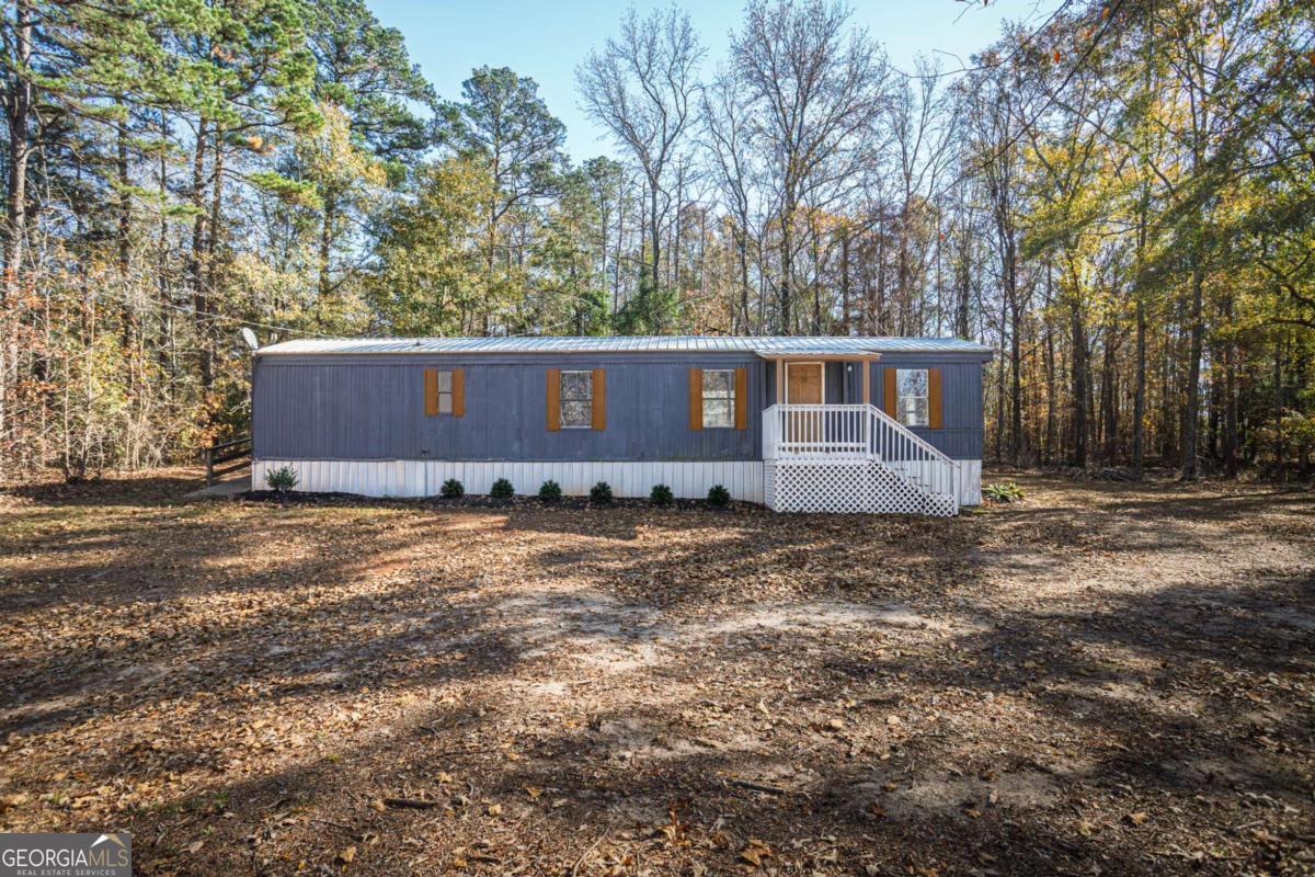 139 Anglin Road Jefferson, GA 30549 - Photo 2 of 26 a view of a house with a yard