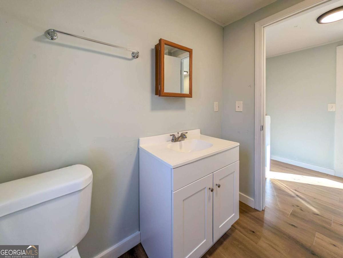139 Anglin Road Jefferson, GA 30549 - Photo 23 of 26 a bathroom with a toilet sink and mirror