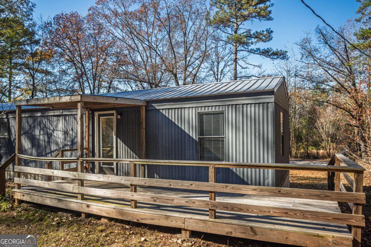 139 Anglin Road Jefferson, GA 30549 - Photo 25 of 26 a view of a house with a large window and wooden fence