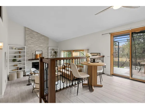 a view of a livingroom with furniture wooden floor and a window