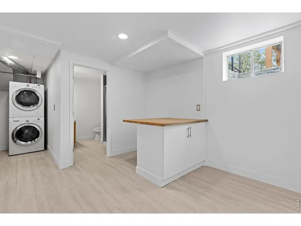 a view of a kitchen with wooden floor