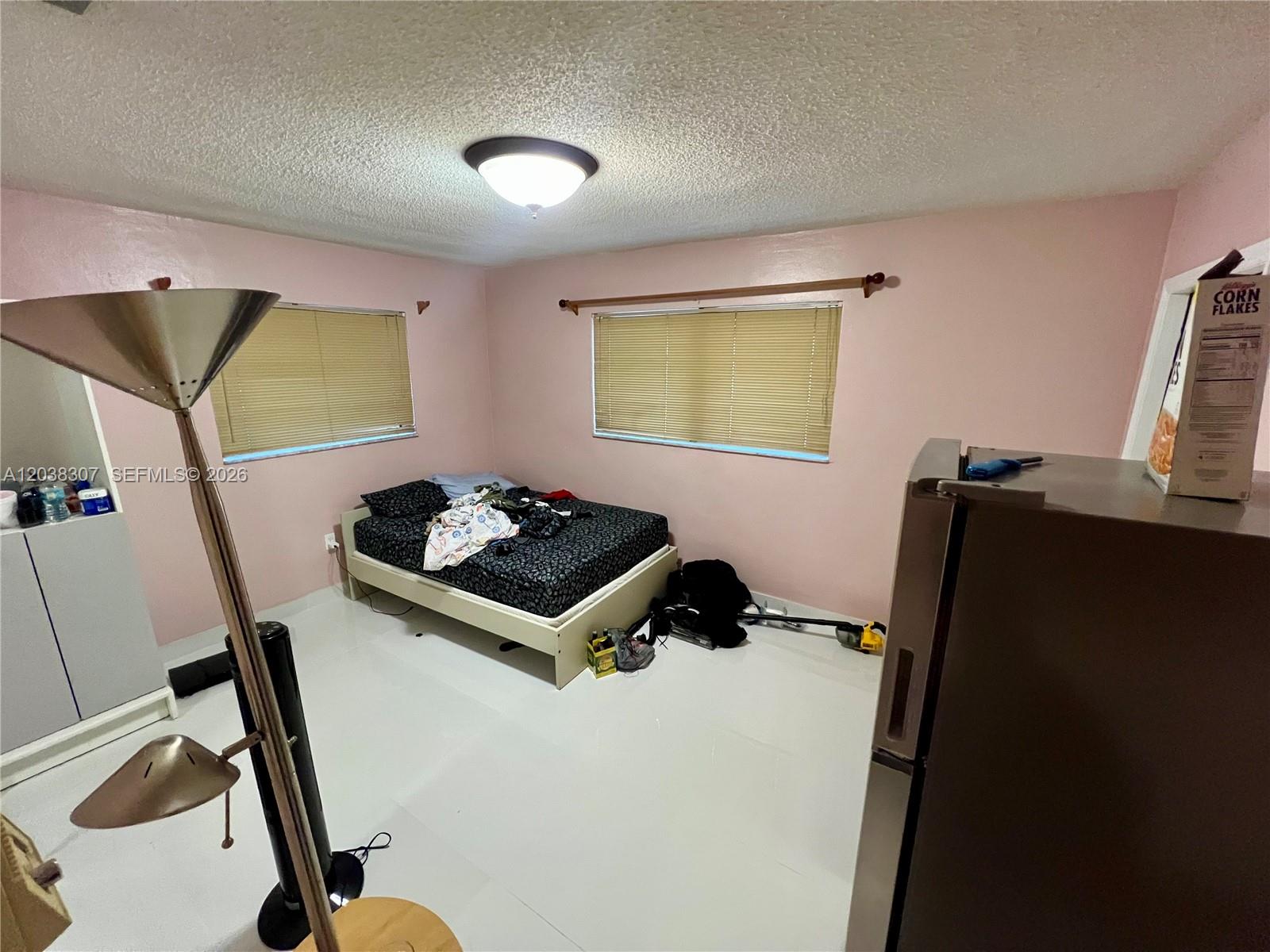 9601 Southwest 66th Street Miami, FL 33173 - Photo 29 of 62 a room that has a bed and a chair in it