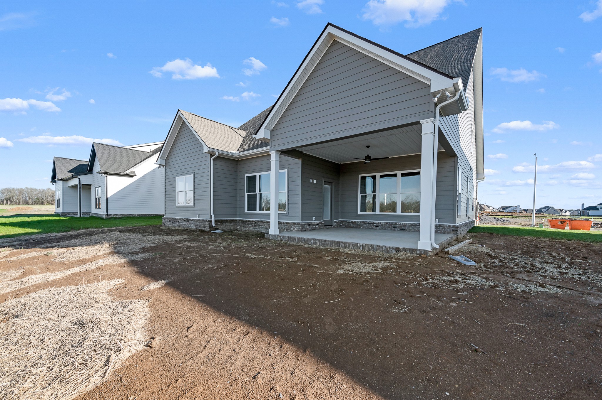4209 McCown Way Murfreesboro, TN 37127 - Photo 29 of 29 a front view of a house with a dirt yard and a garage