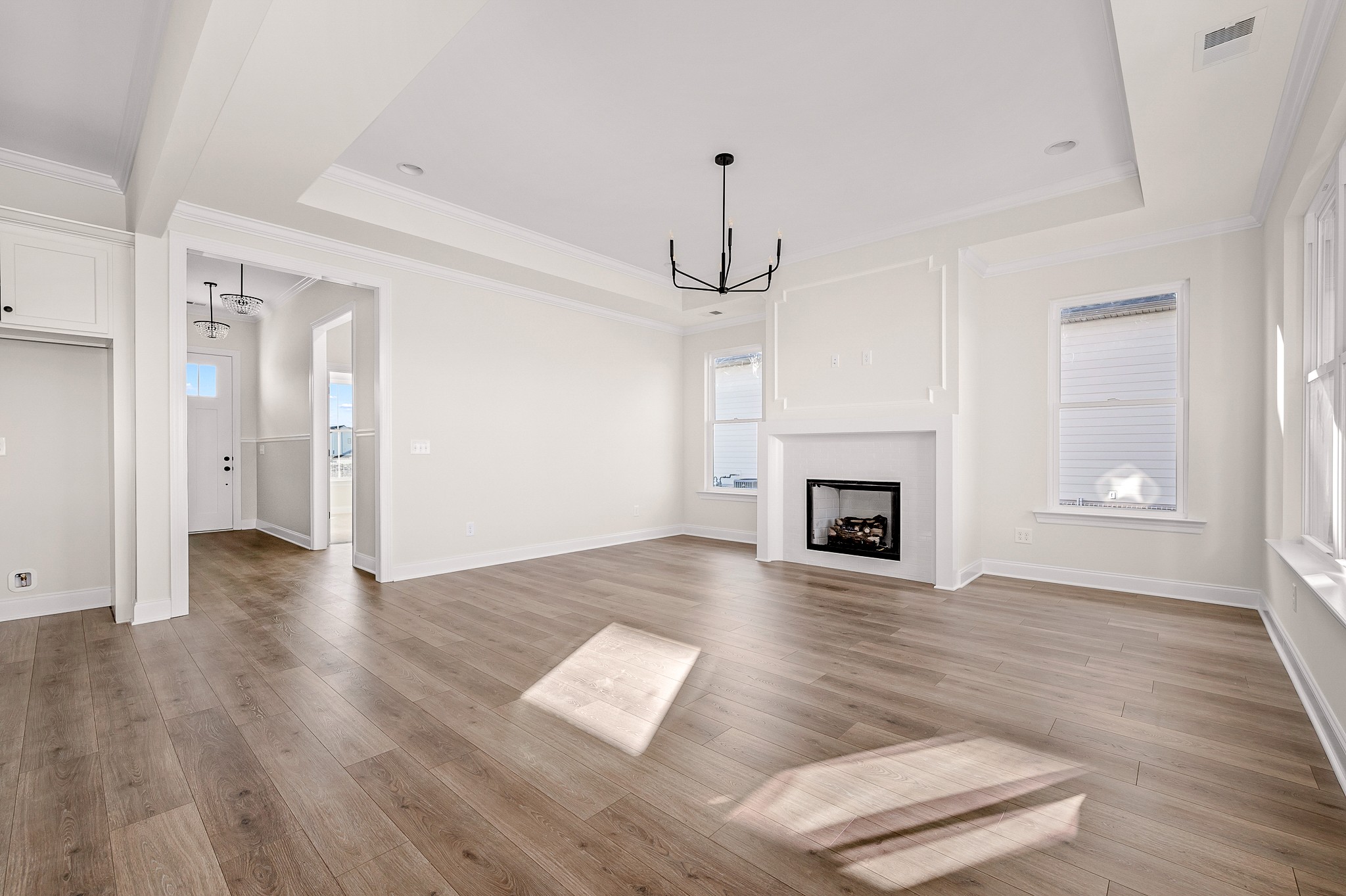 4209 McCown Way Murfreesboro, TN 37127 - Photo 5 of 29 a view of a hallway with wooden floor and a fireplace
