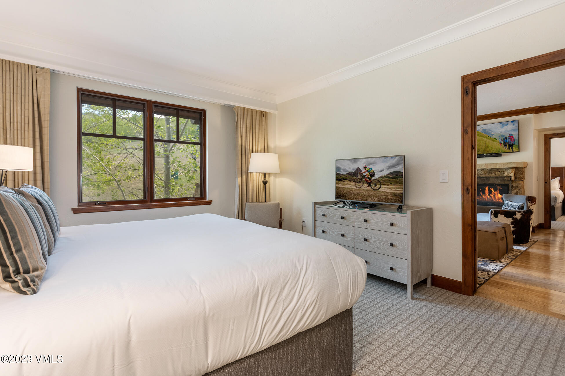 100 Bachelor Ridge Road, Unit 3214 Avon, CO 81620 - Photo 11 of 38 a bedroom with a bed and a large window