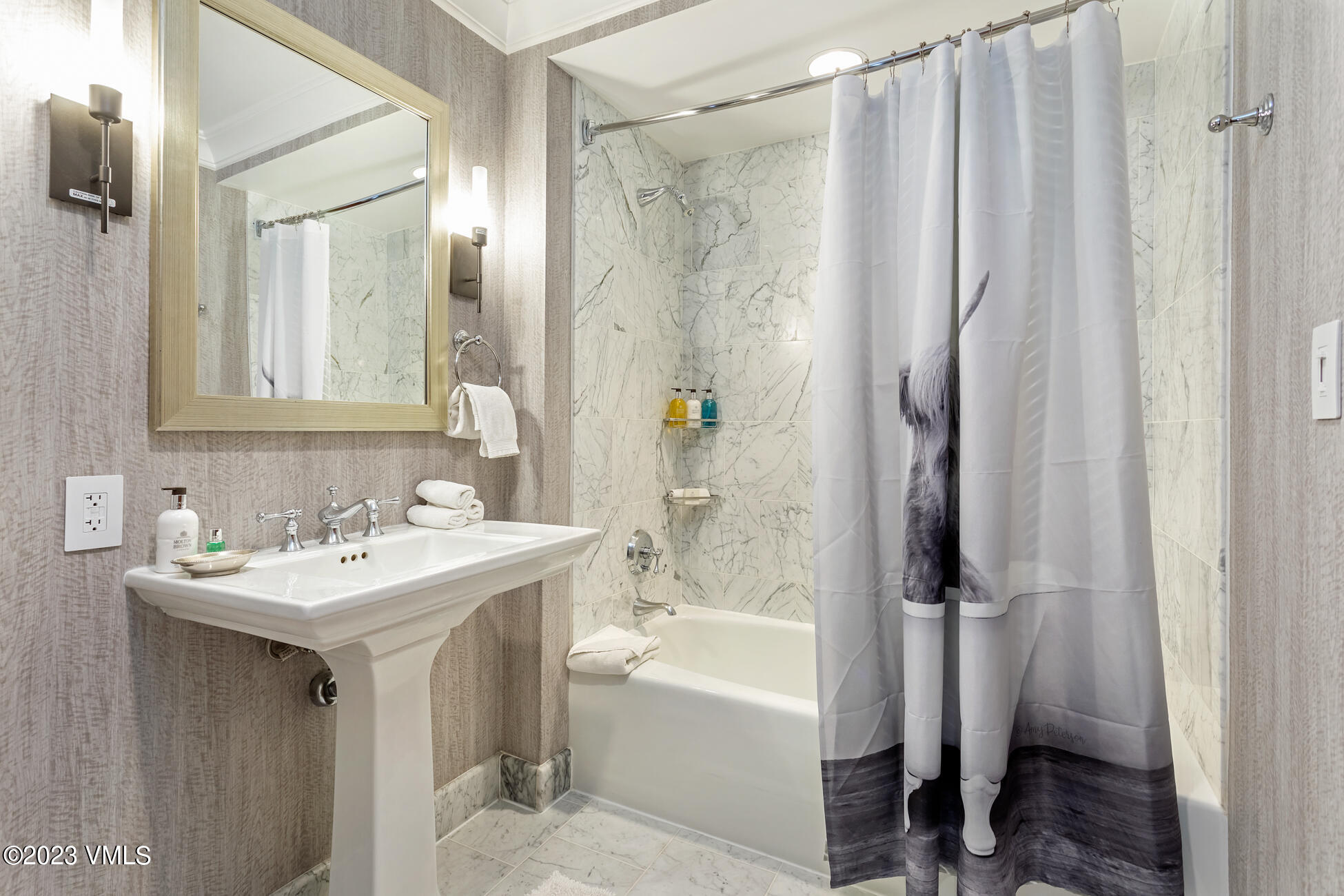 100 Bachelor Ridge Road, Unit 3214 Avon, CO 81620 - Photo 32 of 38 a bathroom with a sink a mirror and a bathtub