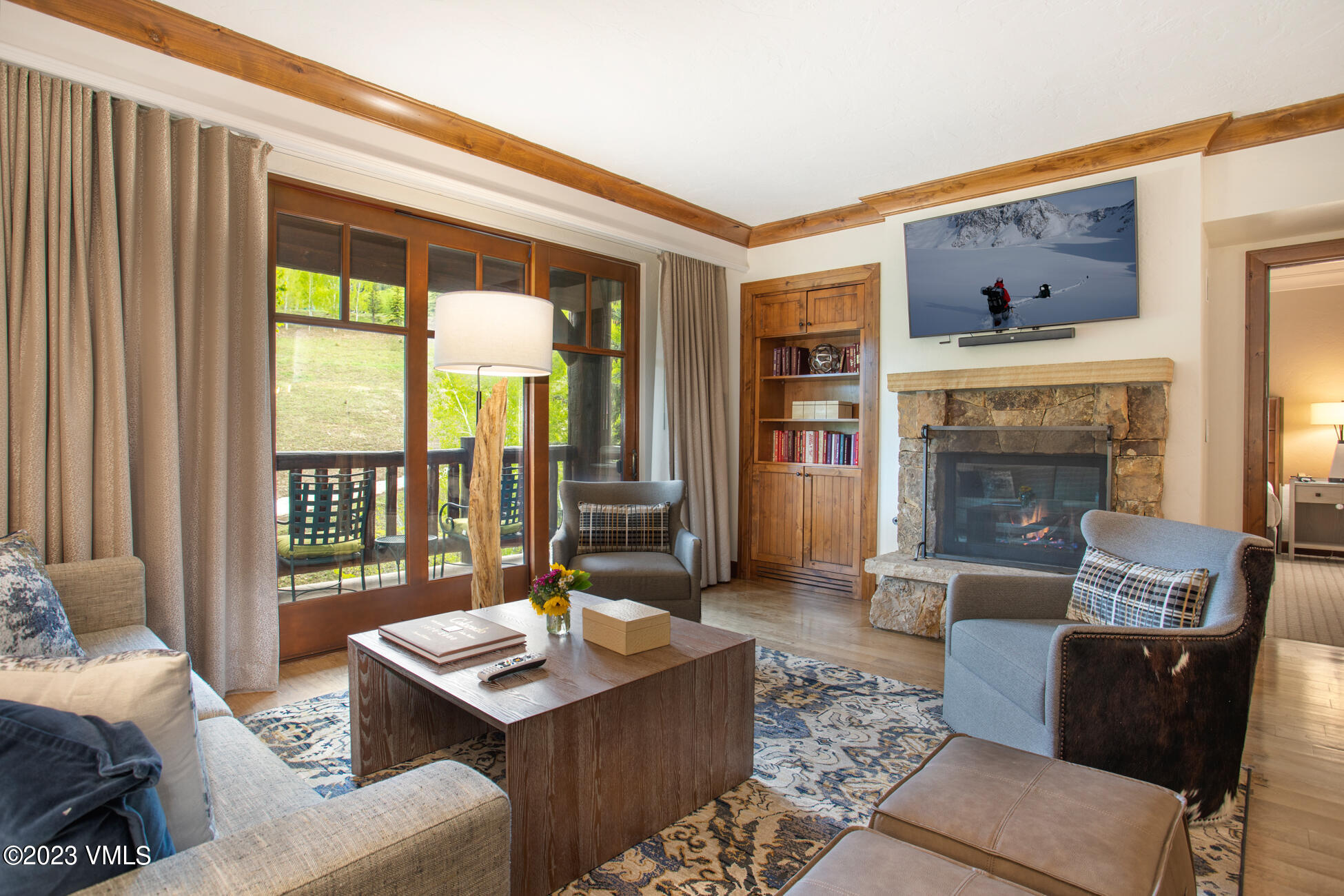 100 Bachelor Ridge Road, Unit 3214 Avon, CO 81620 - Photo 6 of 38 a living room with furniture and a fireplace