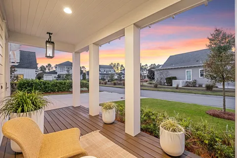 a view of an outdoor dining space with furniture and garden