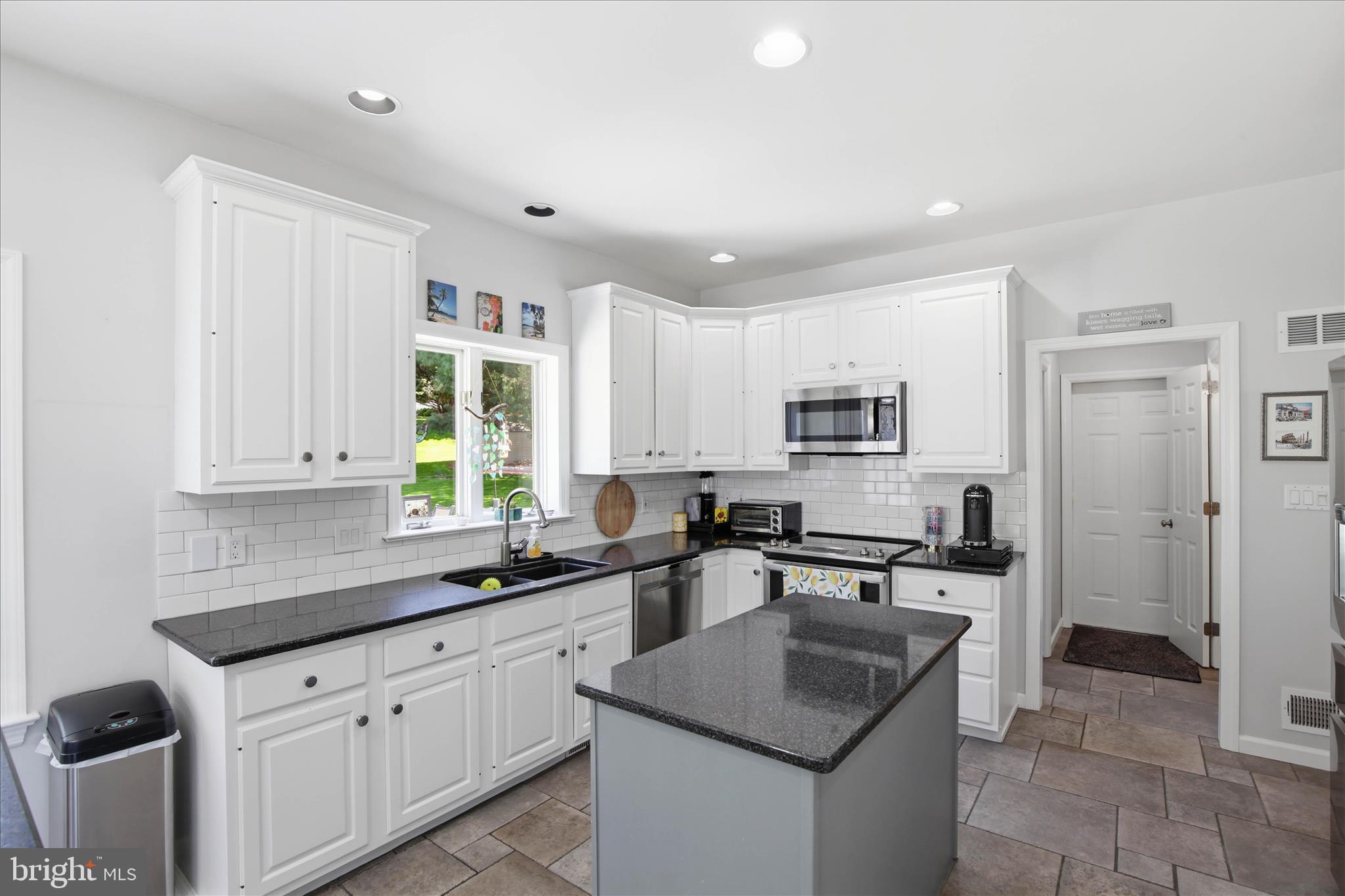 725 Oxford Road Lancaster, PA 17601 - Photo 11 of 46 a kitchen with stainless steel appliances granite countertop a sink stove and refrigerator