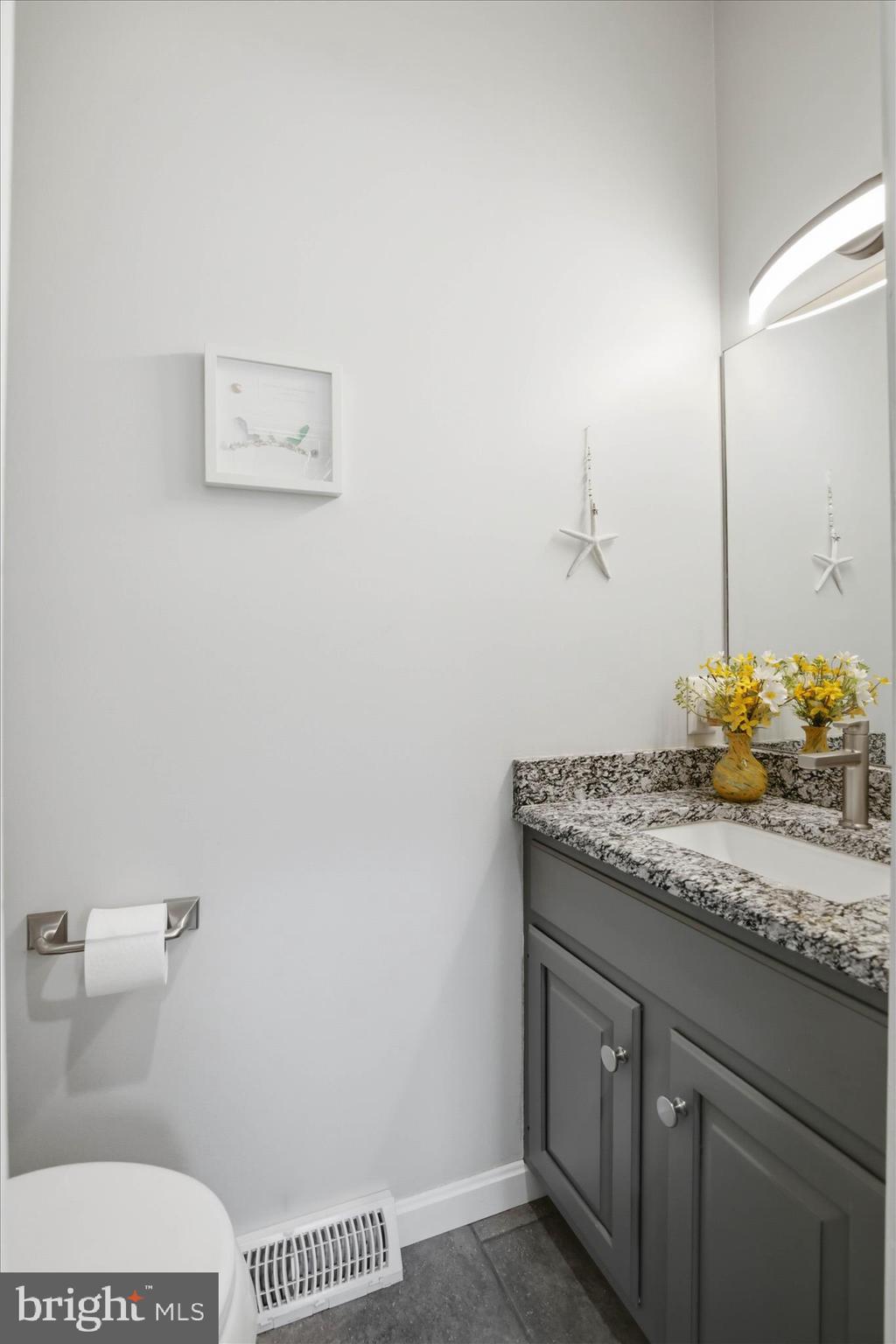 725 Oxford Road Lancaster, PA 17601 - Photo 16 of 46 a bathroom with a granite countertop sink a toilet and a mirror