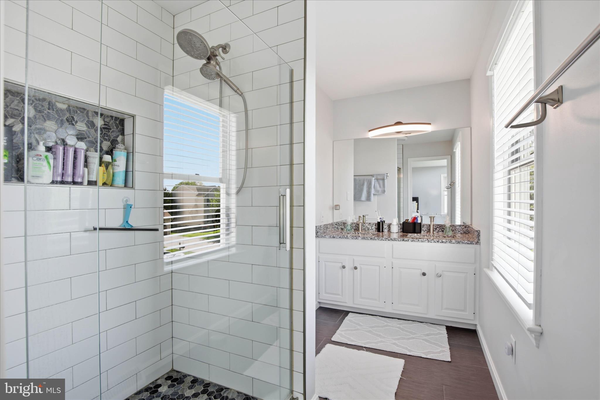 725 Oxford Road Lancaster, PA 17601 - Photo 22 of 46 a bathroom with a sink a mirror and a shower
