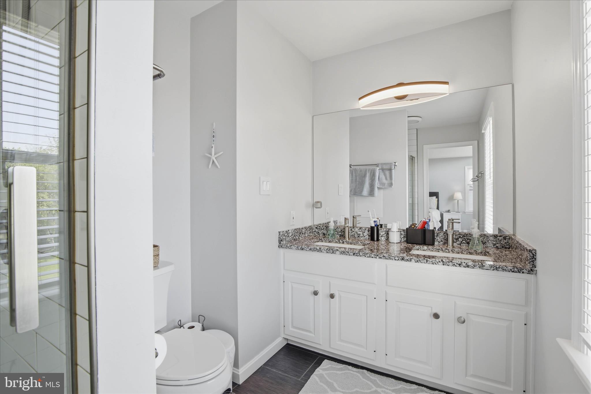 725 Oxford Road Lancaster, PA 17601 - Photo 23 of 46 a bathroom with a double vanity sink and a mirror