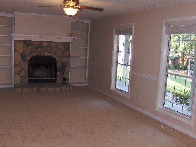 5490 Sardis Church Road Macon, GA 31216 - Photo 3 of 21 a living room with a fireplace and windows