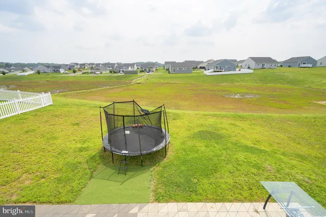 a kitchen with stainless steel appliances granite countertop a sink dishwasher stove and refrigerator